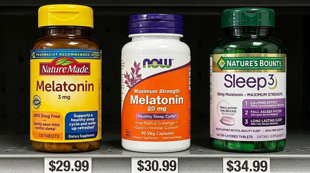 High-dose melatonin bottles on a store shelf with price tags